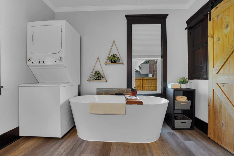 Full Bath 1 is located in the Hallway on the lower level. Tub Only in this full bath. Laundry is also in this room.