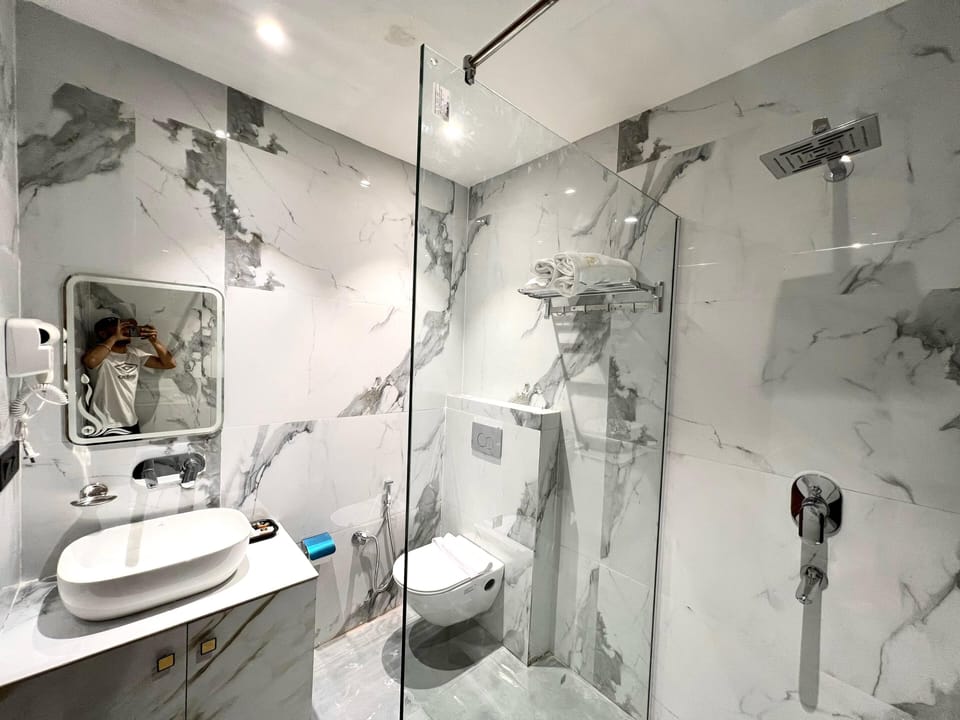 Shower, free toiletries, hair dryer, towels