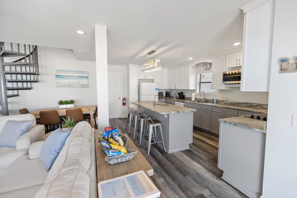 Step into this bright open-concept space where your kitchen island becomes the heart of gathering, perfect for morning coffee or evening conversations.