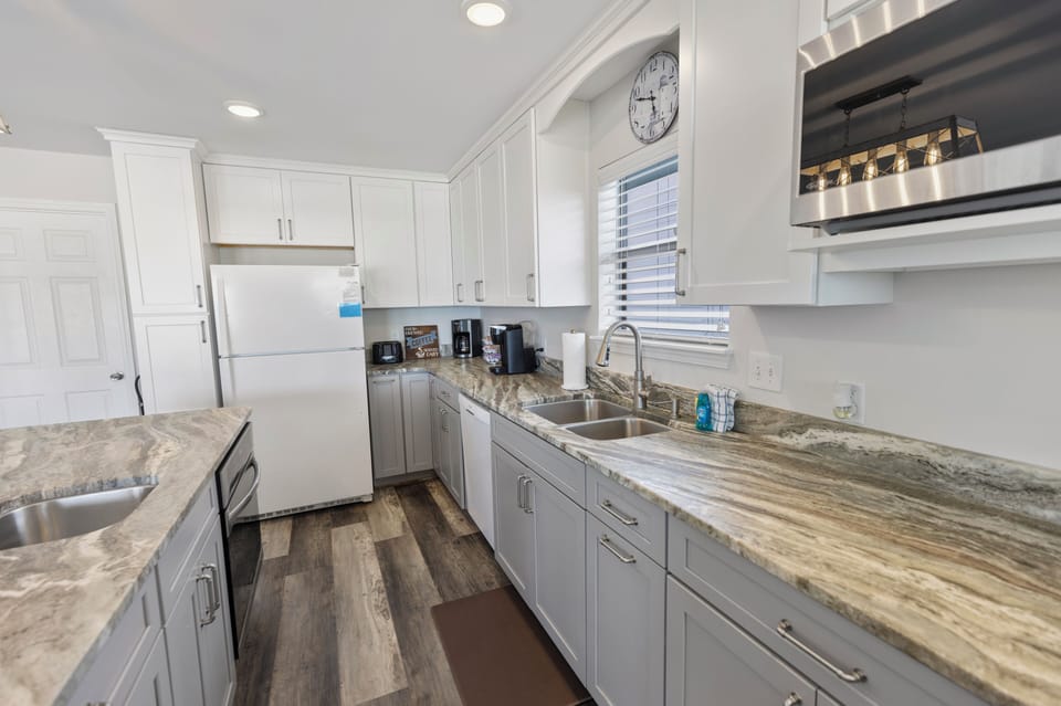 Your fully equipped kitchen features granite countertops, modern appliances, and everything needed to prepare delicious home-cooked meals during your stay.