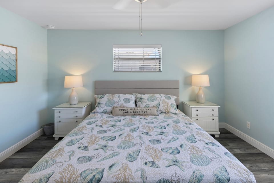 Drift off to peaceful sleep in your coastal-themed bedroom, where soft seashell bedding and gentle blue walls create a soothing seaside retreat.