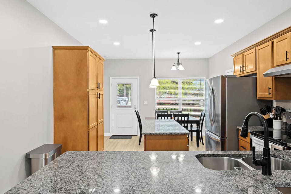 Kitchen: A modern kitchen with granite countertops and stainless steel appliances.