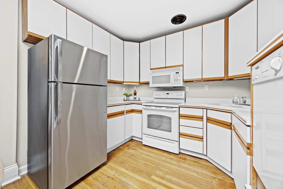 Kitchen:  Bright and functional space to whip up your favorite dishes.
