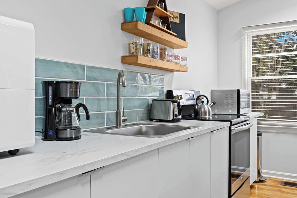 Kitchen 1: Bright and functional space to whip up your favorite dishes.