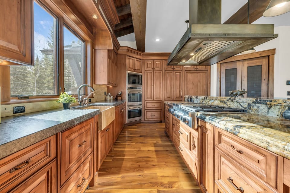 View of kitchen with large windows and double oven