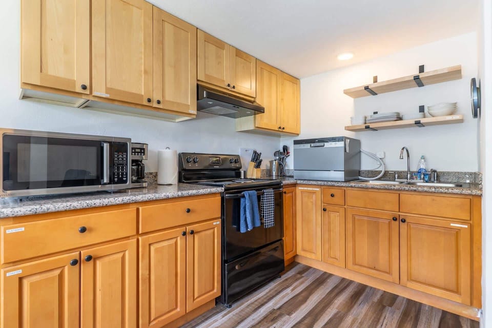 Everything you need for longer stays: cookware, coffee setup, and modern appliances.