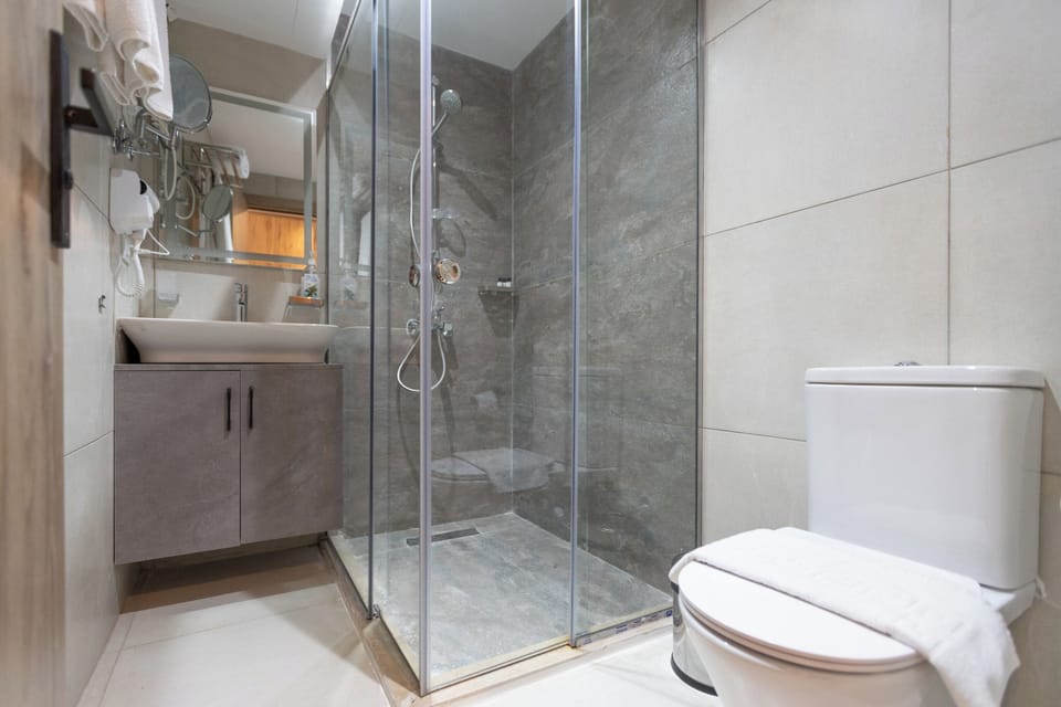 Shower, bathrobes, slippers, towels