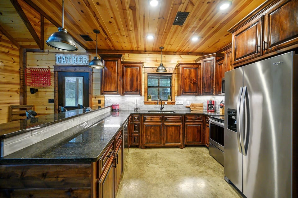 The warm, open kitchen offers ample space & all the comforts of home
