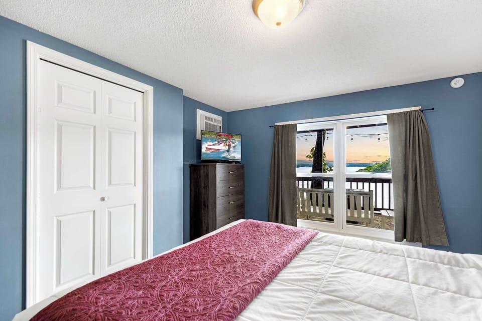 The final bedroom retreat features a queen bed, ensuite, & smart TV