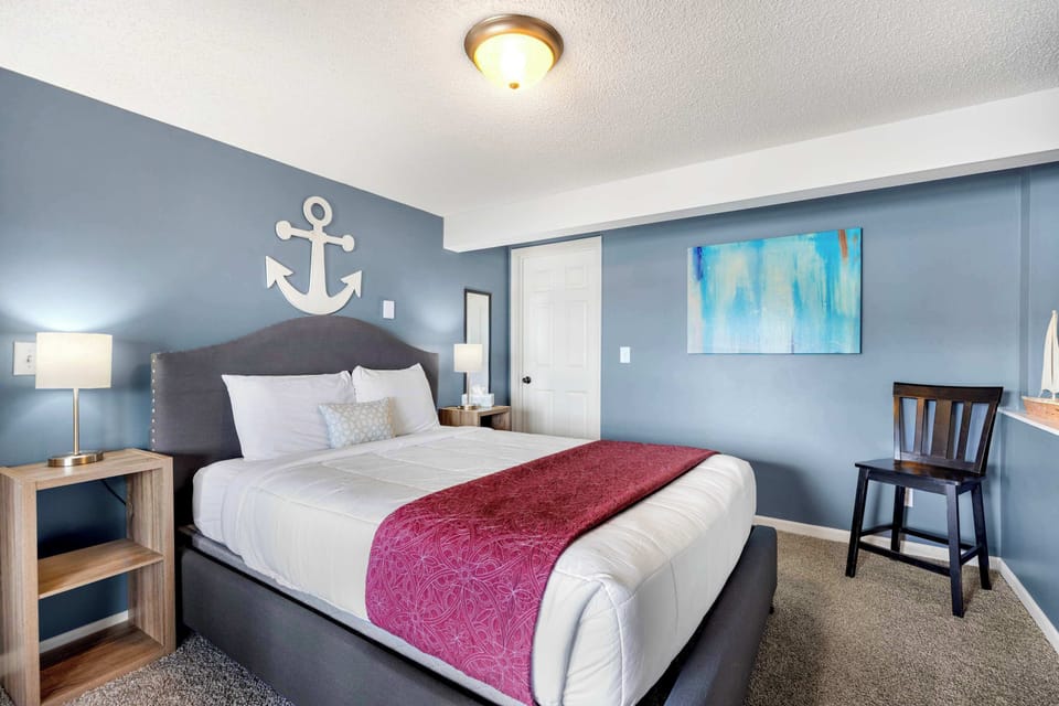 The final bedroom retreat features a queen bed, ensuite, & smart TV