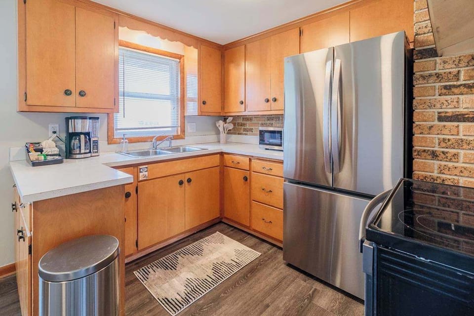 Fully equipped kitchen with everything you need to cook during your stay, including cookware, utensils, and essential appliances. Perfect for easy meals at home. Please note: a brand-new dishwasher has been added since this photo was taken.
