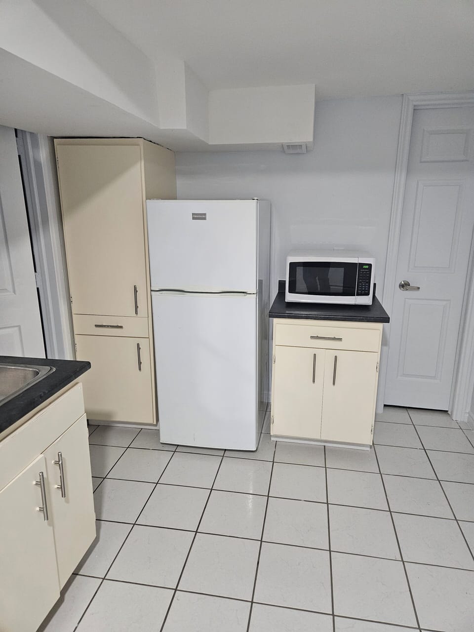 Refrigerator and Microwave in the Kitchenette 