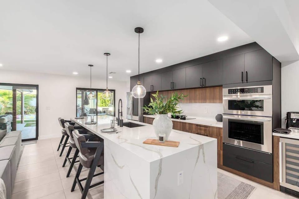 Kitchen is fully equipped with modern appliances, cookware, and a spacious dining area for a seamless cooking experience.