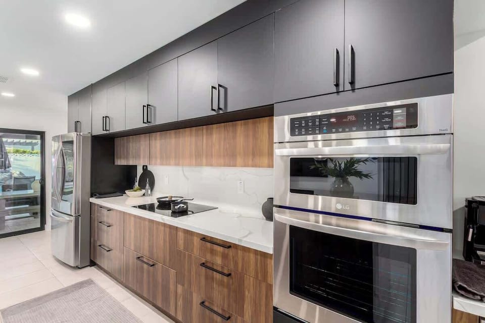 Kitchen is fully equipped with modern appliances, cookware, and a spacious dining area for a seamless cooking experience.