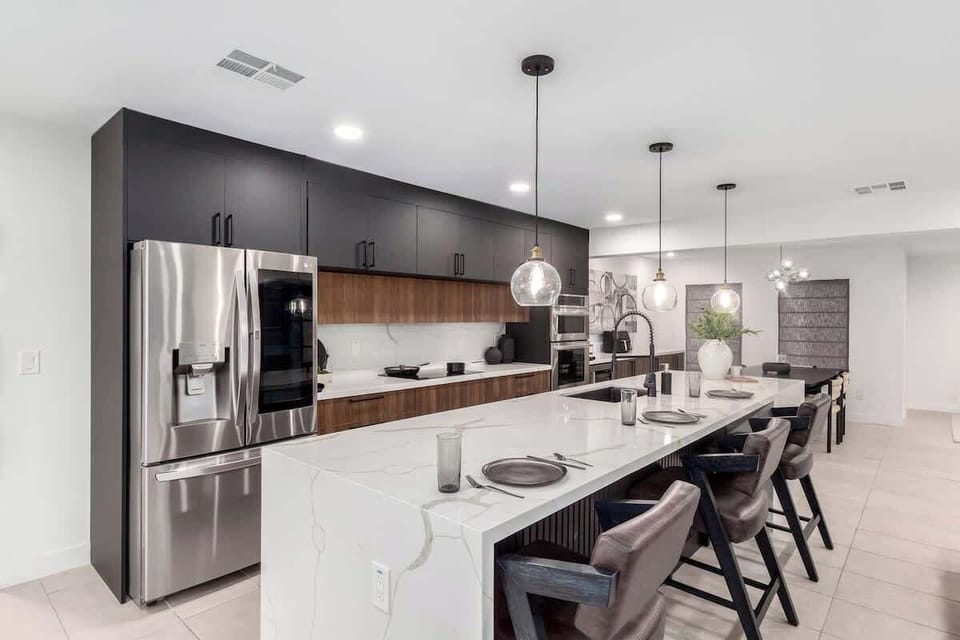 Kitchen is fully equipped with modern appliances, cookware, and a spacious dining area for a seamless cooking experience.