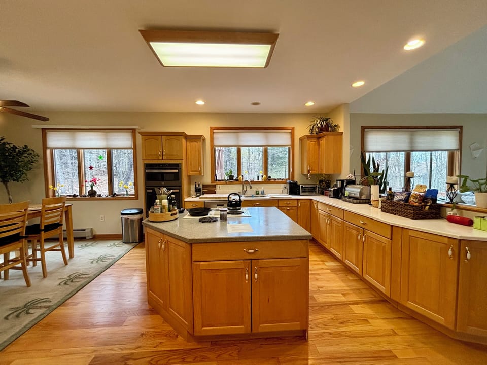 Large open kitchen with three coffee makers)Keurig, french press, and drip 