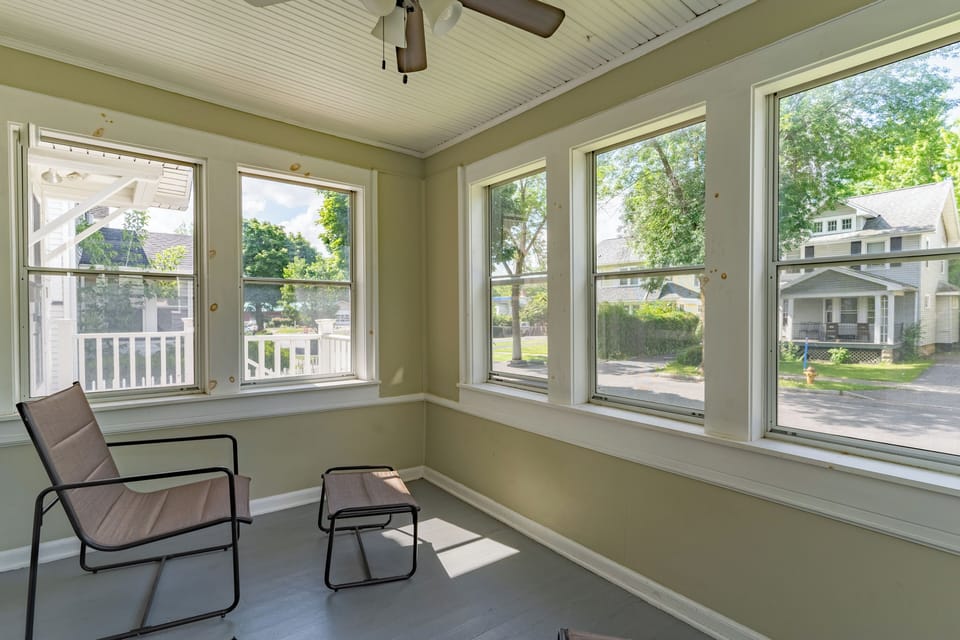Enclosed front porch, windows on three sides, enjoy the neighborhood!