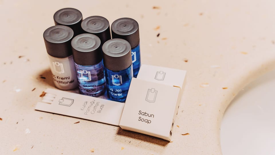 Shower, hair dryer, slippers, towels