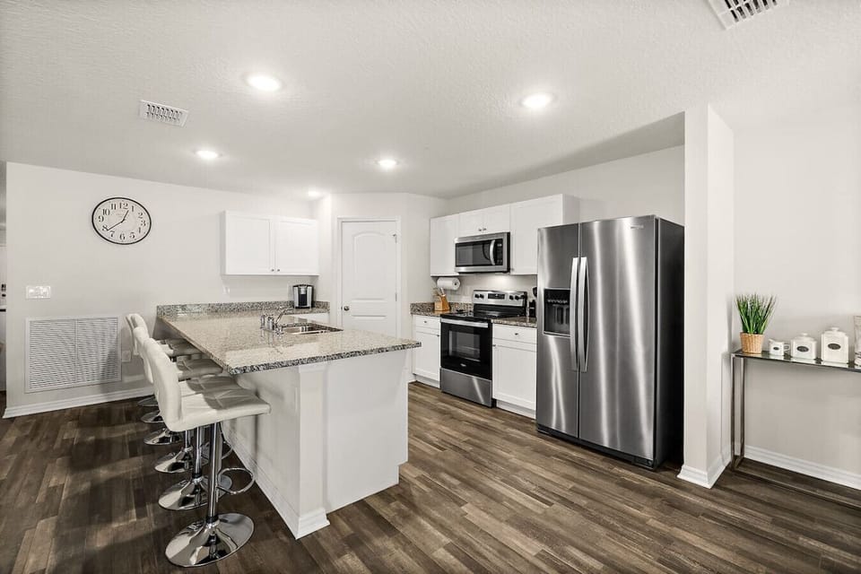 Fully stocked kitchen with modern appliances and everything you need to cook at home
