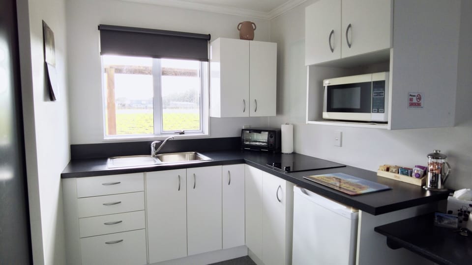 Comfort Studio | Private kitchen | Microwave, stovetop, highchair, cookware/dishes/utensils