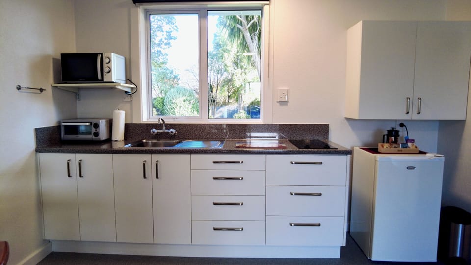 Comfort Suite | Private kitchen | Microwave, stovetop, highchair, cookware/dishes/utensils