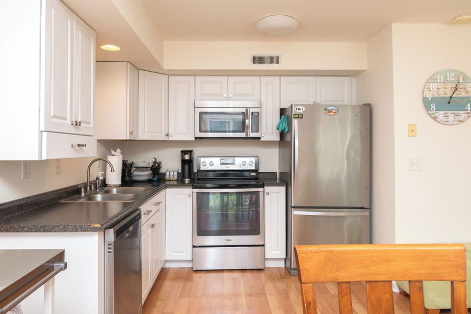 Kitchen is well equipped with both large and small appliances.