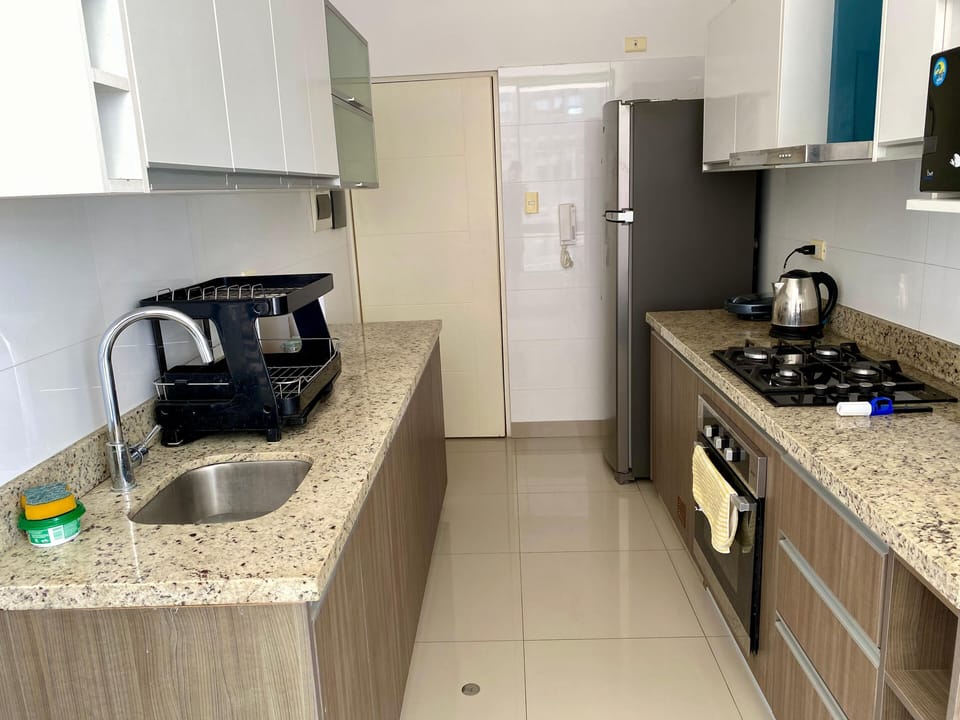 Family Apartment, Balcony, Pool View | Private kitchen