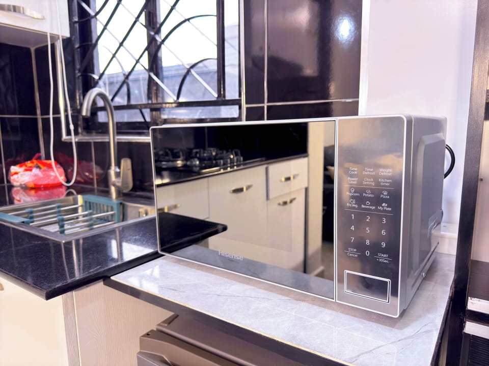 Standard Apartment | Private kitchen | Microwave, oven, stovetop, cookware/dishes/utensils