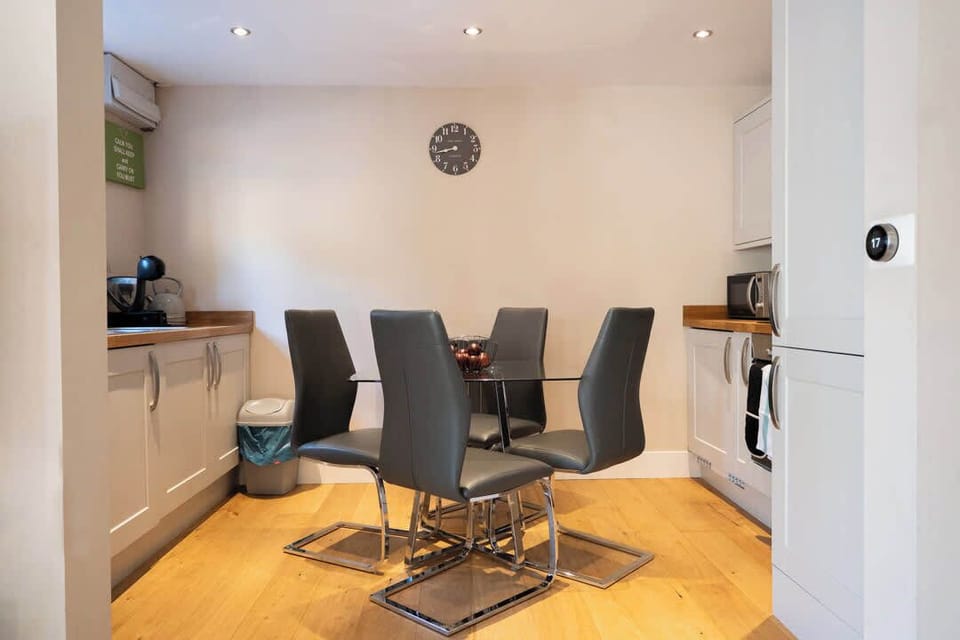 Gather around this elegant dining table and the kitchen equipped with your cooking essentials for unforgettable meals and moments.