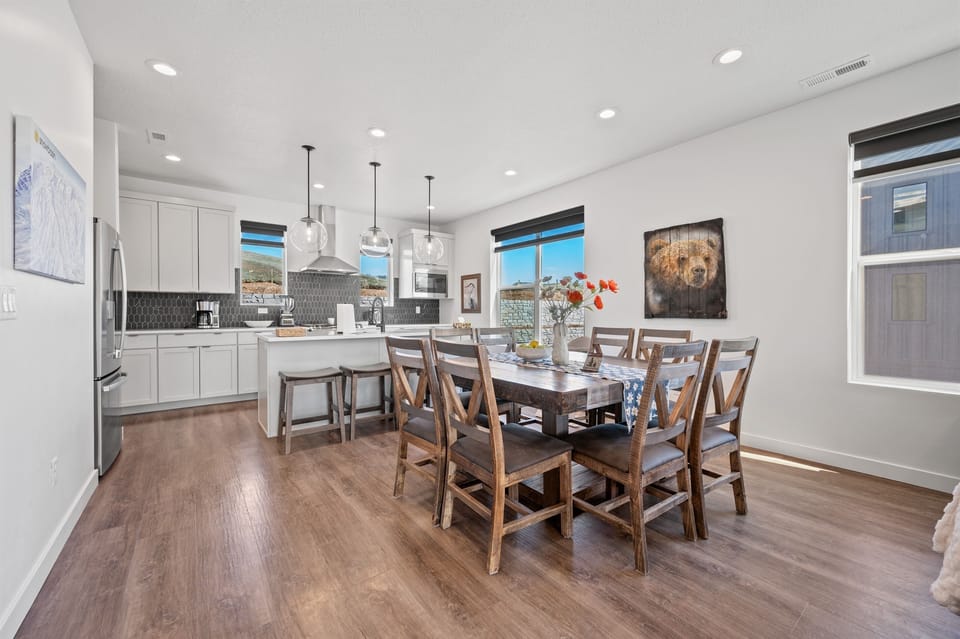 The dining table seats 8 and the kitchen island allows 4 more.