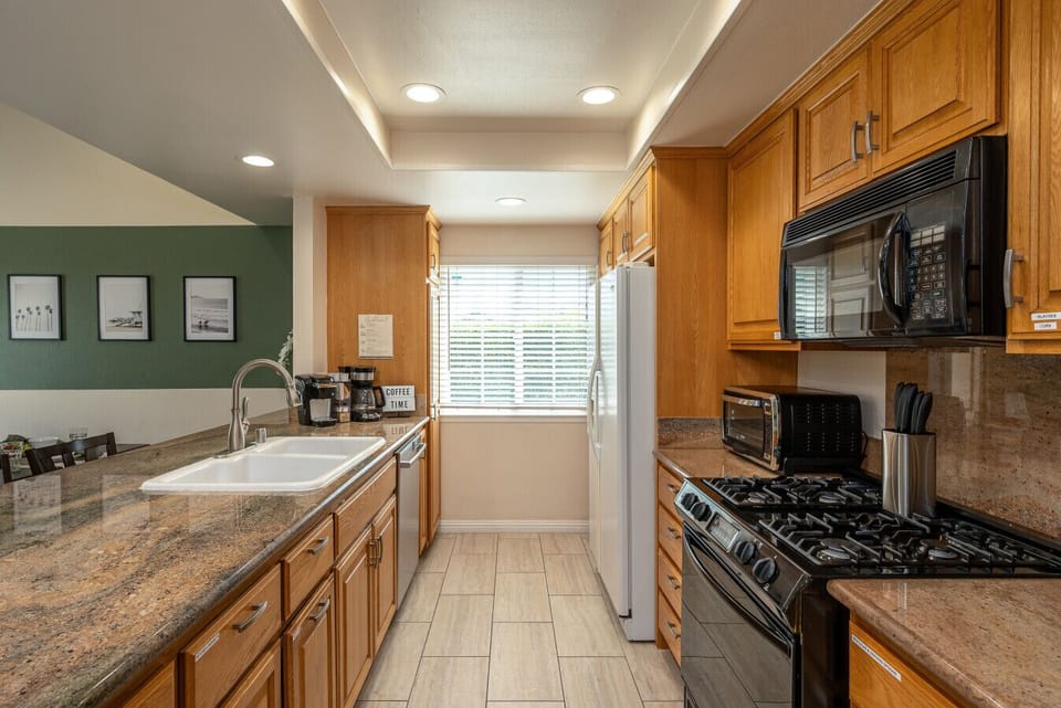 Sleek appliances and smart design make this kitchen a dream for home chefs and snack lovers alike.