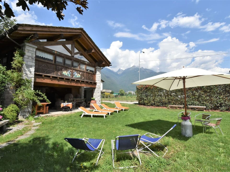 Cloud, Plant, Sky, Property, Building, Furniture, Shade, Chair, Outdoor Furniture, Land Lot
