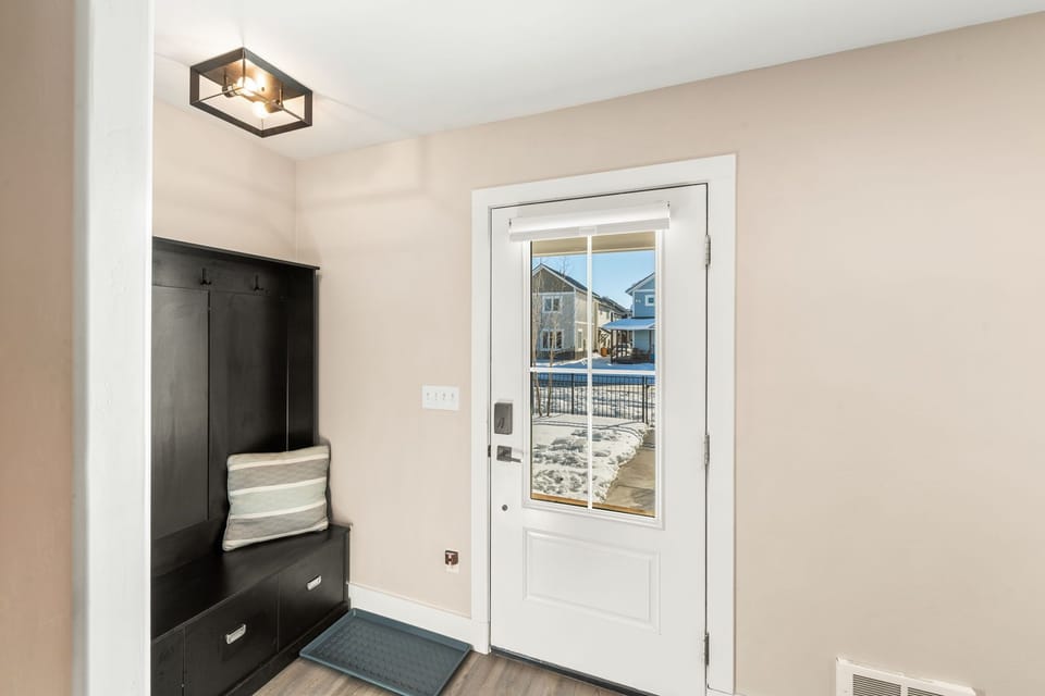 Front entry with coat and storage area.