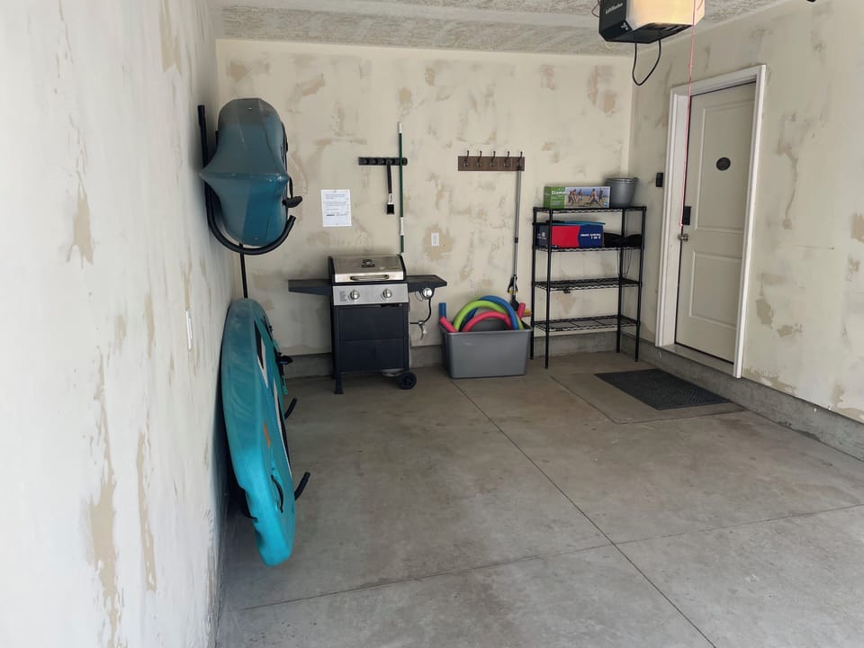 Attached one car garage with kayak paddle board yard games beach toys and BBQ