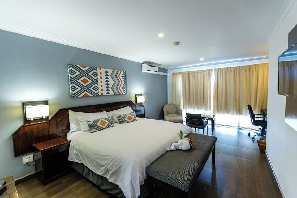 Superior Room | In-room safe, desk, laptop workspace, blackout drapes