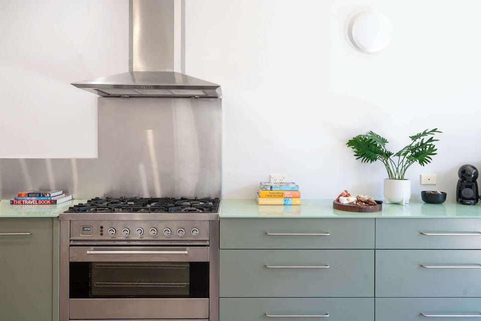 Chefs kitchen with all amenities, 6 burner gas stove top, microwave, coffee machine and large pantry with bi fold doors opening up to the garden 