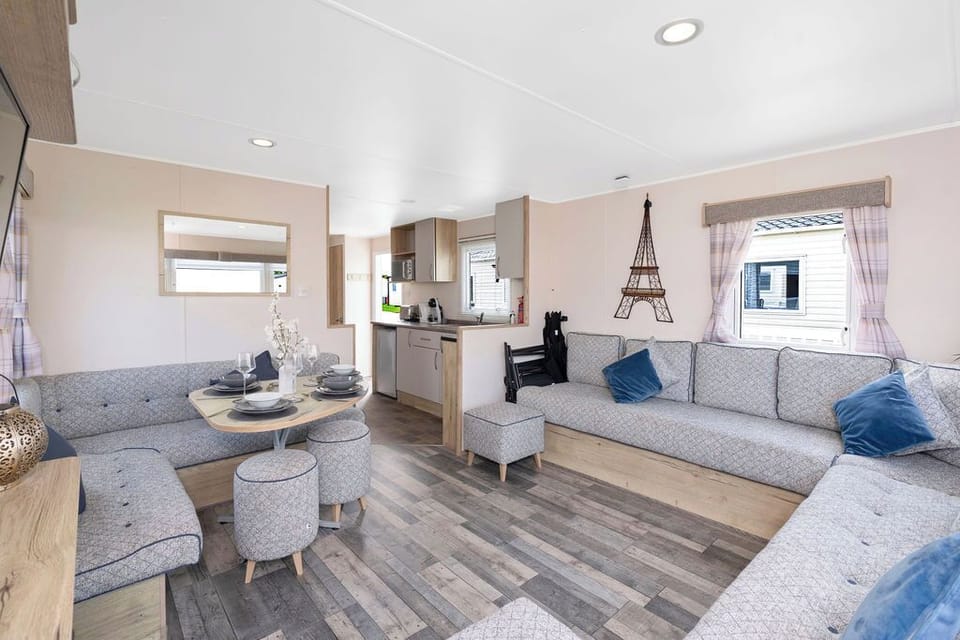 Modern, airy holiday unit with spacious seating, stylish dining, and a well-equipped kitchen—ideal for a relaxing stay.