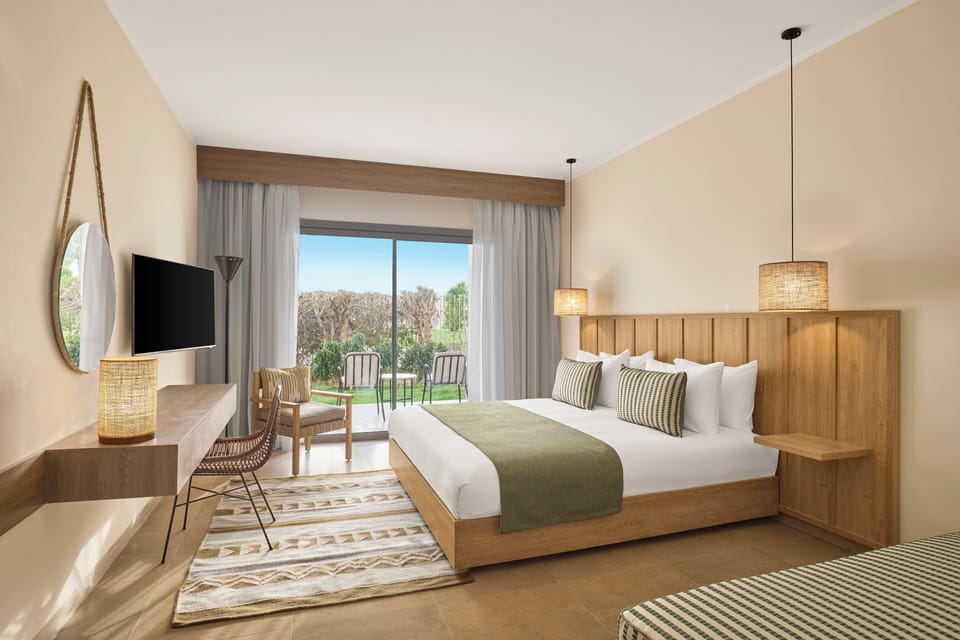 Superior Room, Garden View (Queen or Twin) | Minibar, in-room safe, individually decorated, iron/ironing board