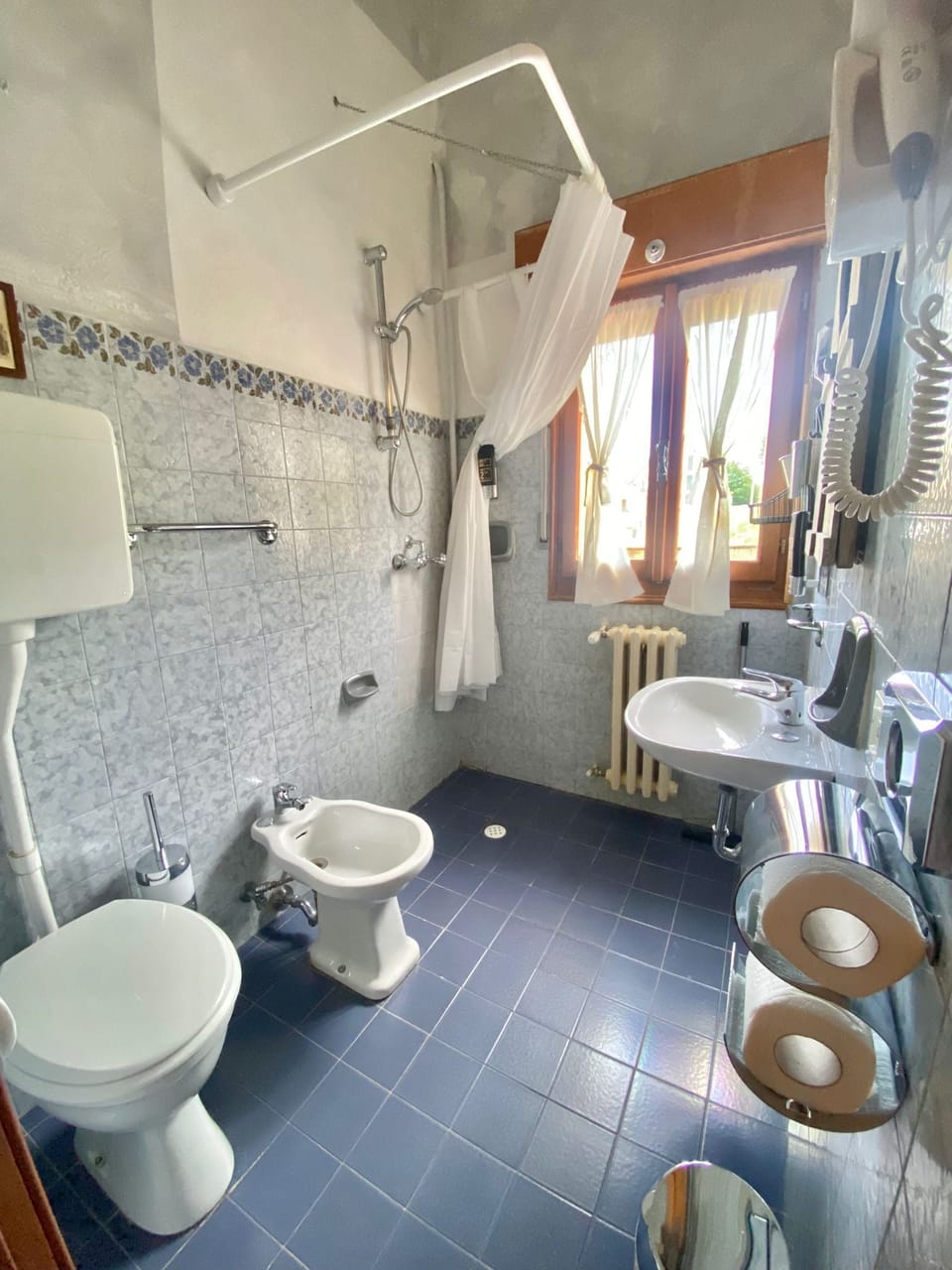 Combined shower/tub, hair dryer, towels, soap
