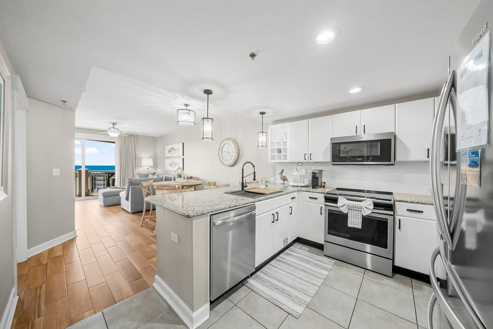The fully equipped kitchen features stainless-steel appliances, granite countertops, and has everything you need to prepare meals for family & friends.
