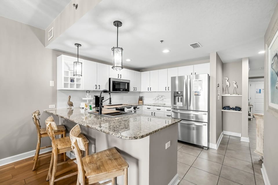 The fully equipped kitchen features stainless-steel appliances, granite countertops, and has everything you need to prepare meals for family & friends.