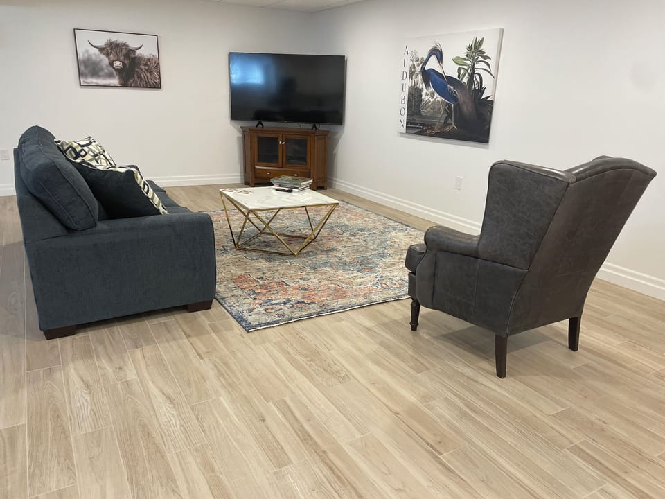 Living area with 70 inch TV.