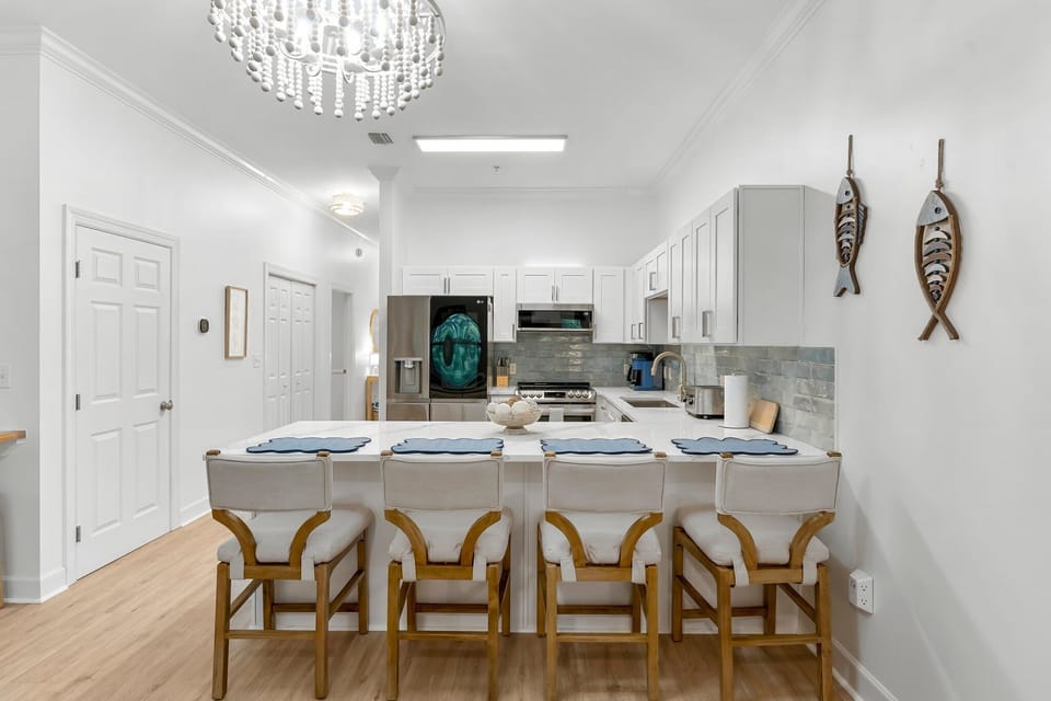 The kitchen is adjacent to the living room space and includes a pantry as well. 