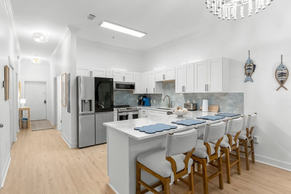 The large kitchen island provides a place for 4 people to sit for meals. 