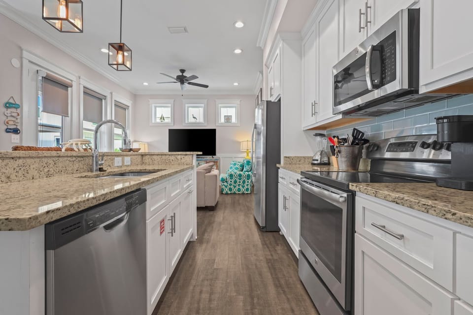 Fully equipped kitchen with dishwasher, microwave, stove, oven and Keurigs