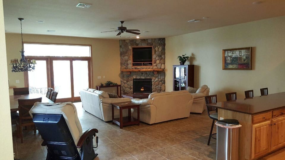 Entertainment lounge, dining table, massage chair, and kitchen counter seating