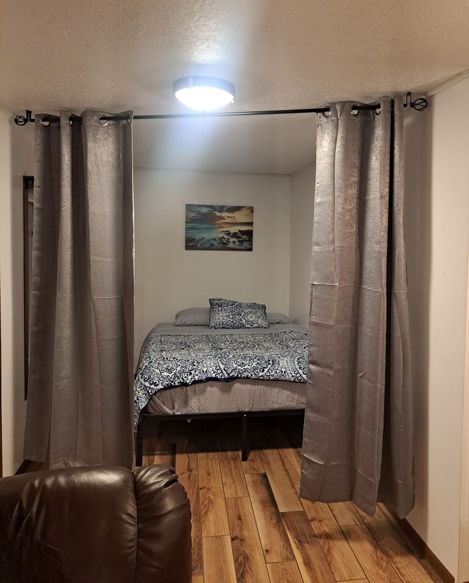 Sleeping nook with privacy curtain. 