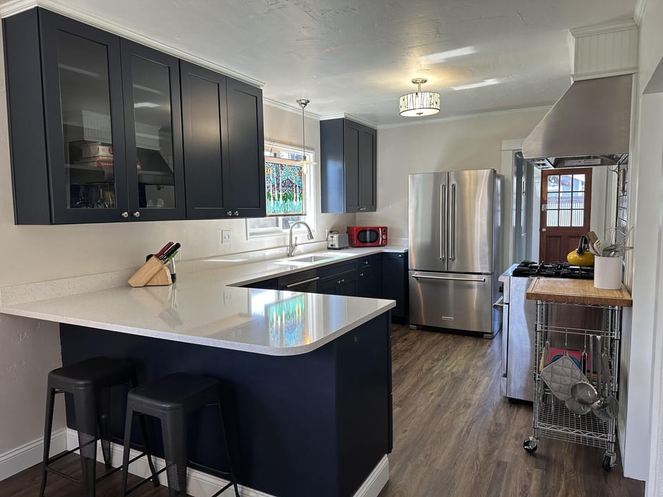 Lovely quartz countertops and a modern, new kitchen