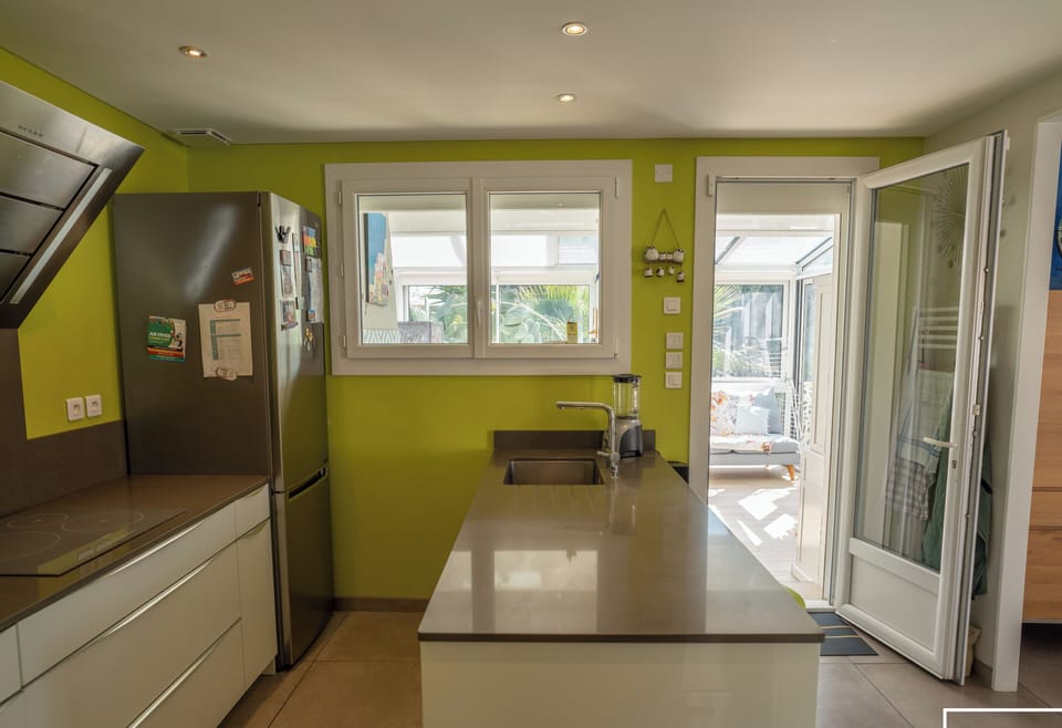 Fitted kitchen opening onto the conservatory and living room