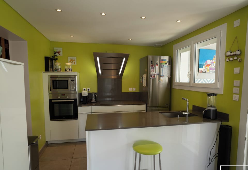 Fitted kitchen opening onto the living area